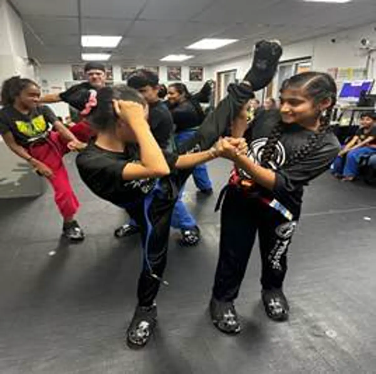Black Belt Story – Falak Kotadia 2 Falak Kotadia training with other students at Mastery Martial Arts martial arts school in Troy Michigan