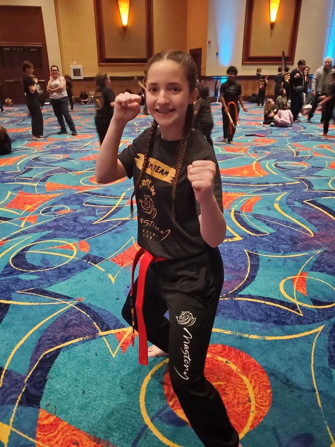 Kyleigh McCaw competing in a martial arts demo tournament at a youth martial arts competition, showing leadership and skill
