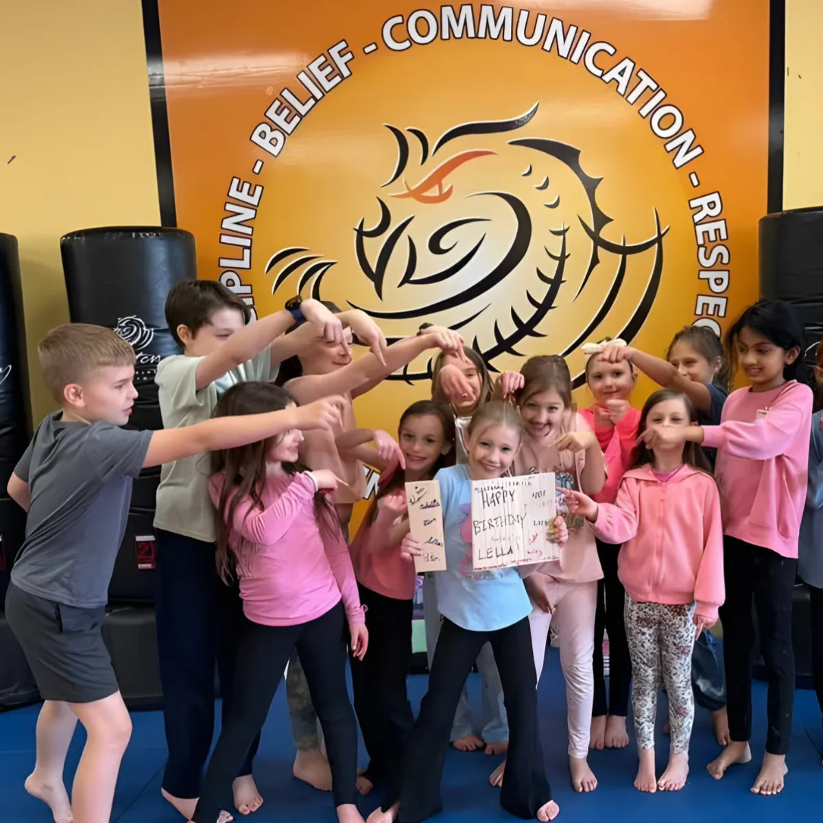 Birthday guests celebrating together at a Mastery Martial Arts party