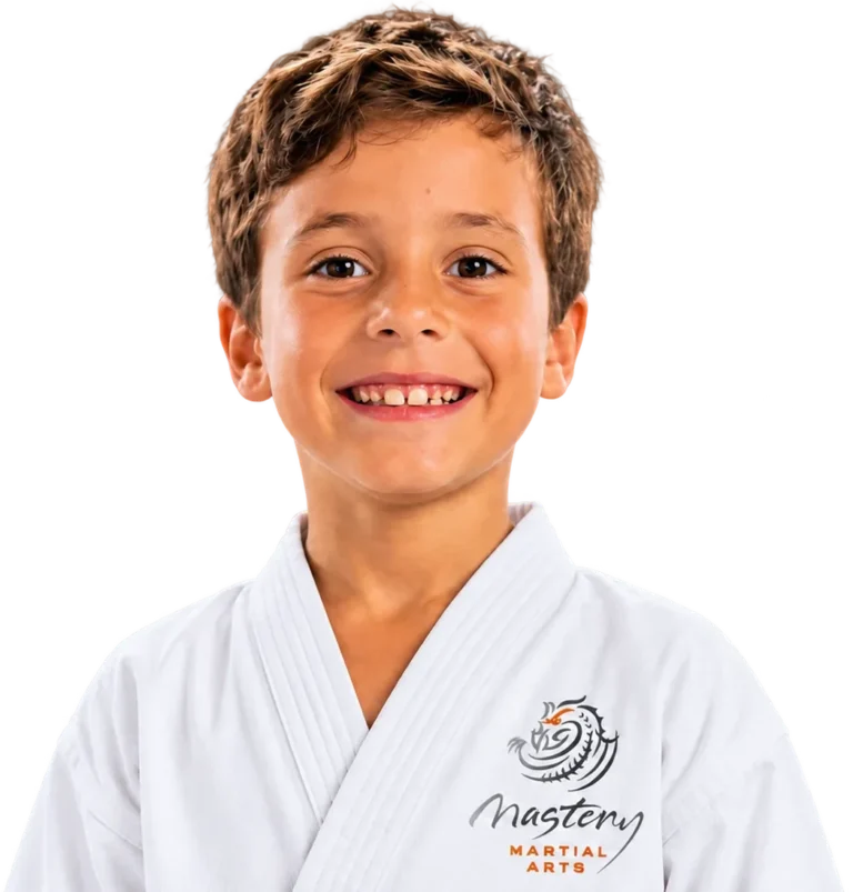 Home 1 Smiling Mastery Martial Arts student in a white uniform